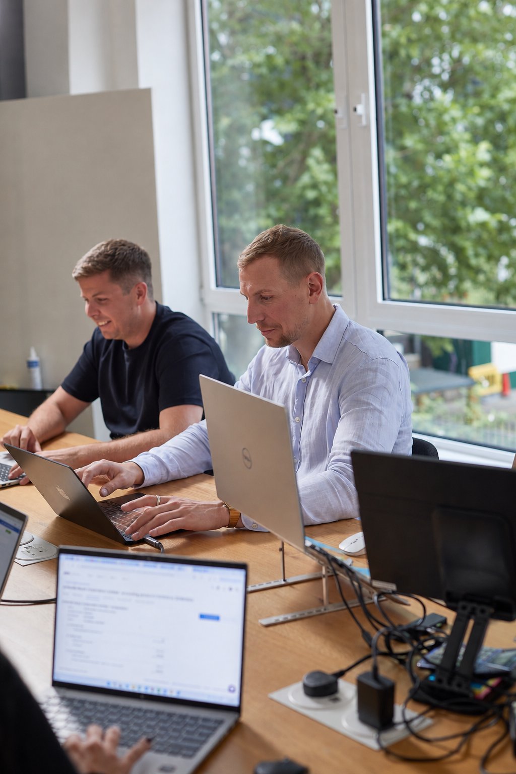 Etienne and Peter working at their laptops